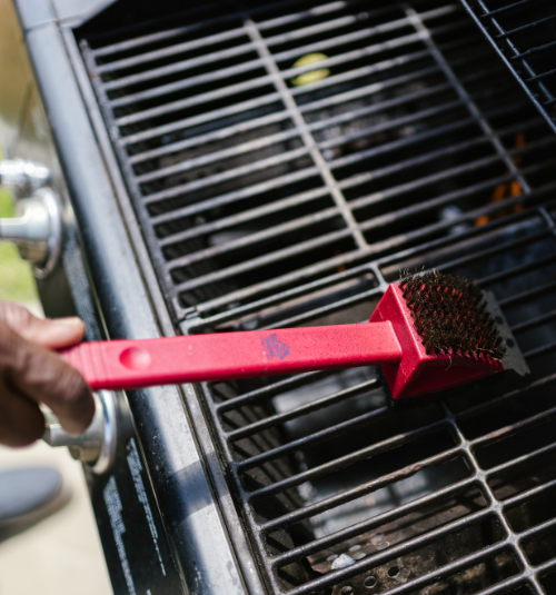Technician deep cleaning a commercial griddle