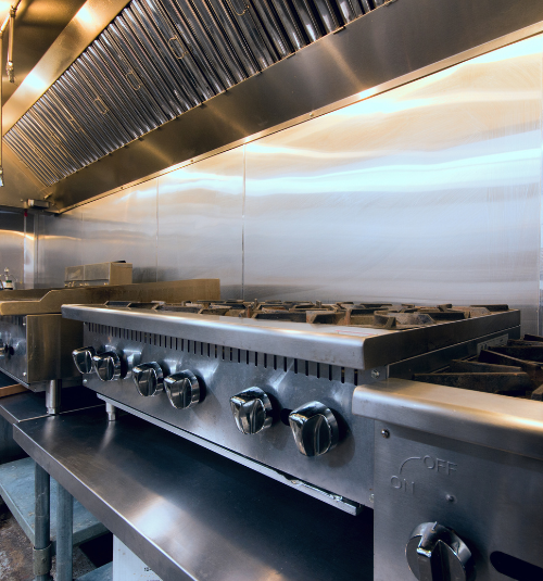 Technician repairing commercial ventilation system