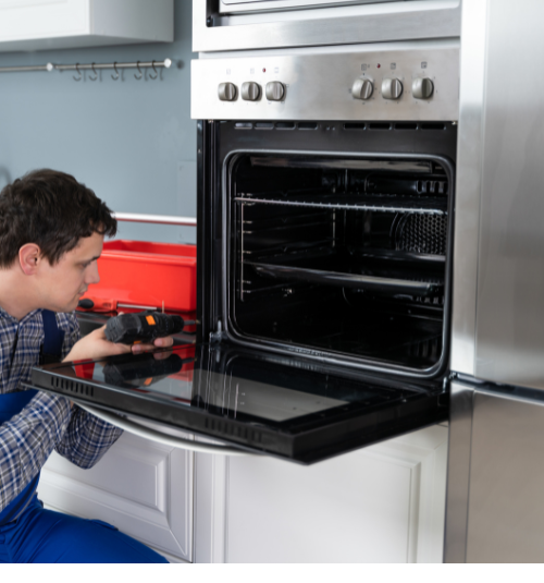Technician testing oven after repair